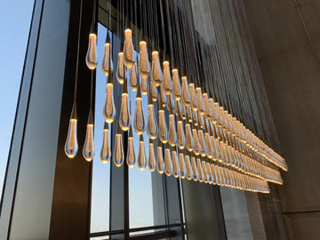 Soltaire Lighting Collection — Seeded-Glass “Raindrop” Pendants & Chandeliers