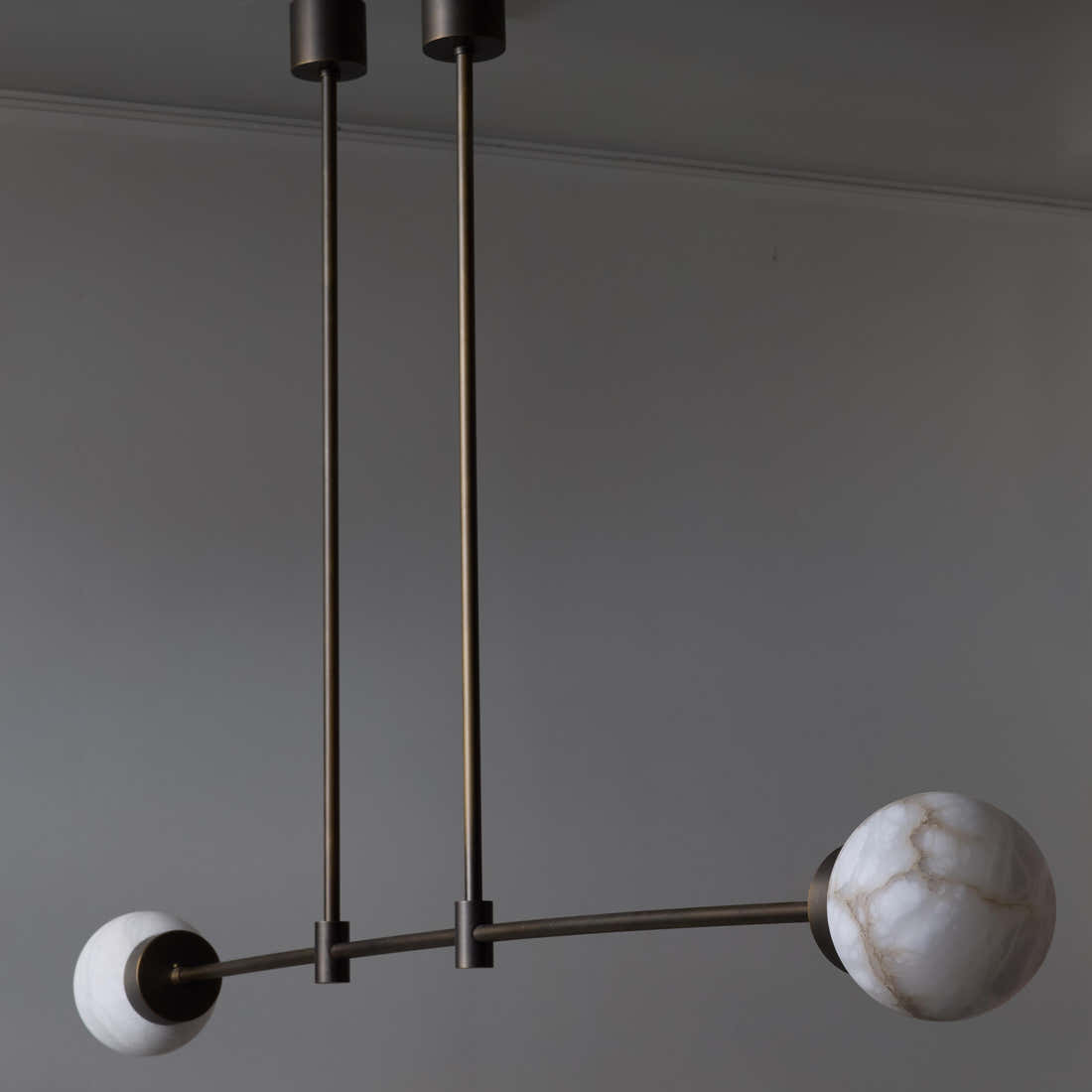 Brass and Alabaster Globes Asymmetrical Line Chandelier