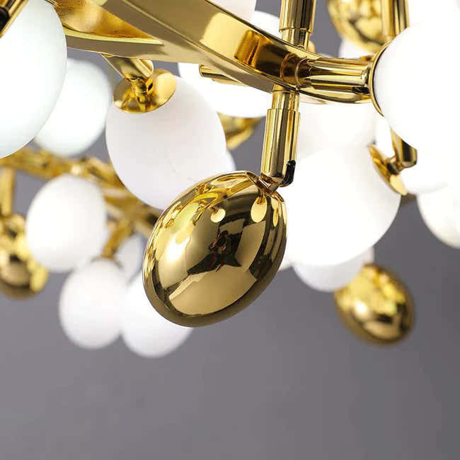 Post Modern Linear Grape Branch Chandelier Over Dining Table